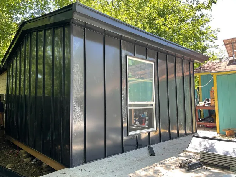 Black standing seam metal wall panels for Roof Inspection in Beebe