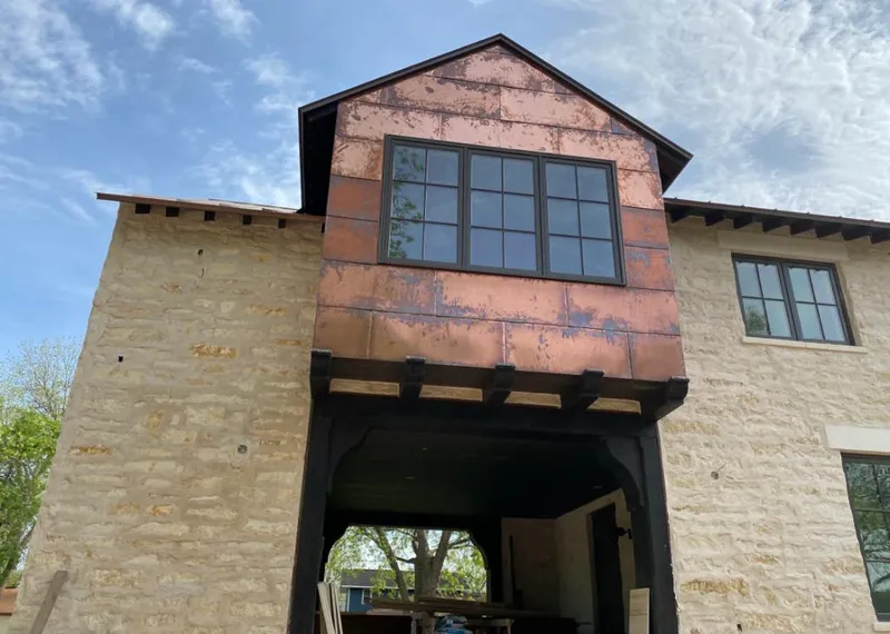 Copper metal panel facade on a stone building for Skylight Installation in Beebe